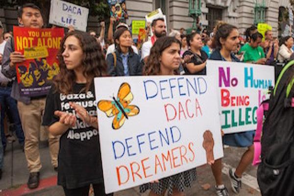 Protesters in San Francisco, September 5, 2017 with posters that read defend daca